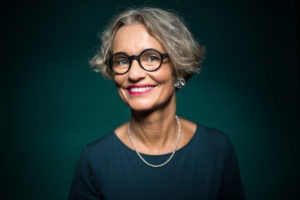 Older women wearing glasses after her eye exam.